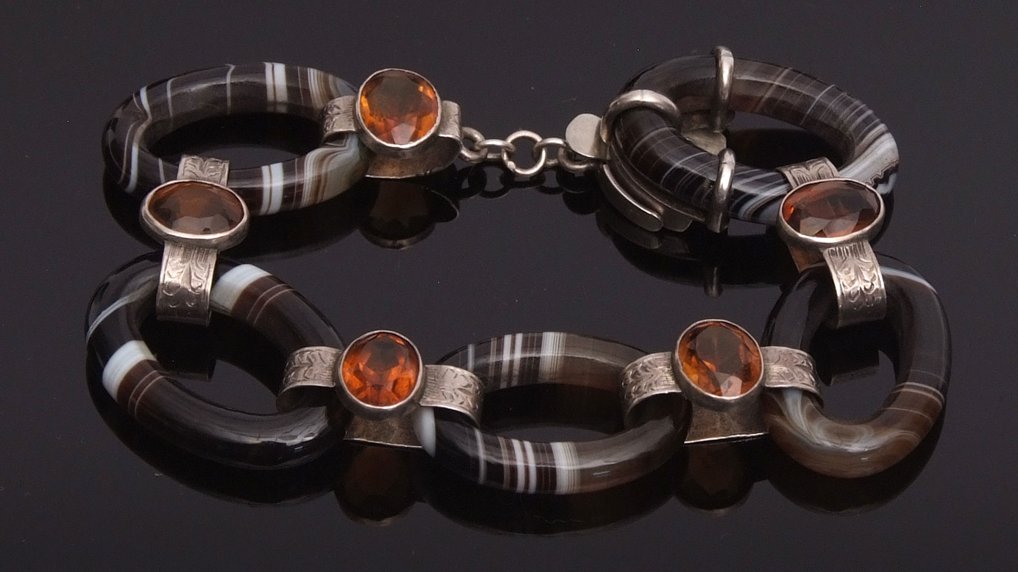 Late 19th century banded agate and citrine bracelet, comprising 5 oval agates joined by 5 collet set