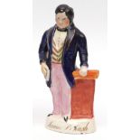 Mid-19th century Staffordshire figure of James B Rush, with blue coat and pink trousers, modelled