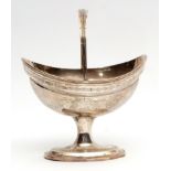 George III Irish swing handled table basket with hinged and reeded handle and rim, to an engraved