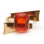 18ct gold fire opal designer ring, the rectangular shaped opal (10 x 6mm) set between twin