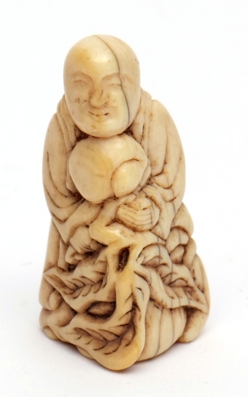 Japanese ivory netsuke of a standing Sennin holding a large peach spray, possibly late 18th century,