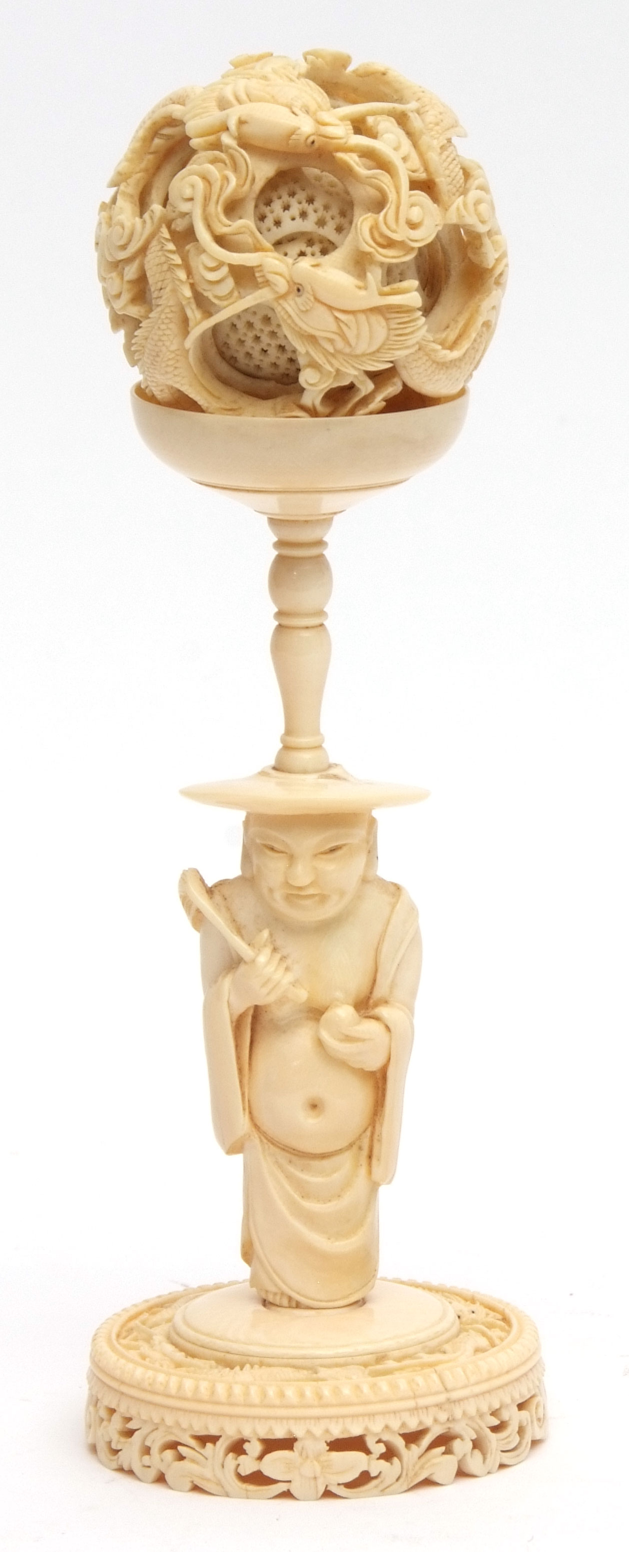 Chinese ivory puzzle ball carved with writhing dragons amidst clouds, on an ivory immortal stand,