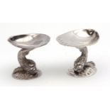 Pair of hallmarked Irish table salts, each modelled in the form of a natural oyster shell held aloft