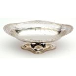 George V table basket of lobed oval form with embossed rim, pierced gallery to a polished field