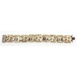 Chinese mother of pearl plaque bracelet, finely painted with hunting and palace scenes, 19 1/2cm