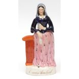 Mid-19th century Staffordshire figure of Emily Sandford with rare pink dress and title in gilt