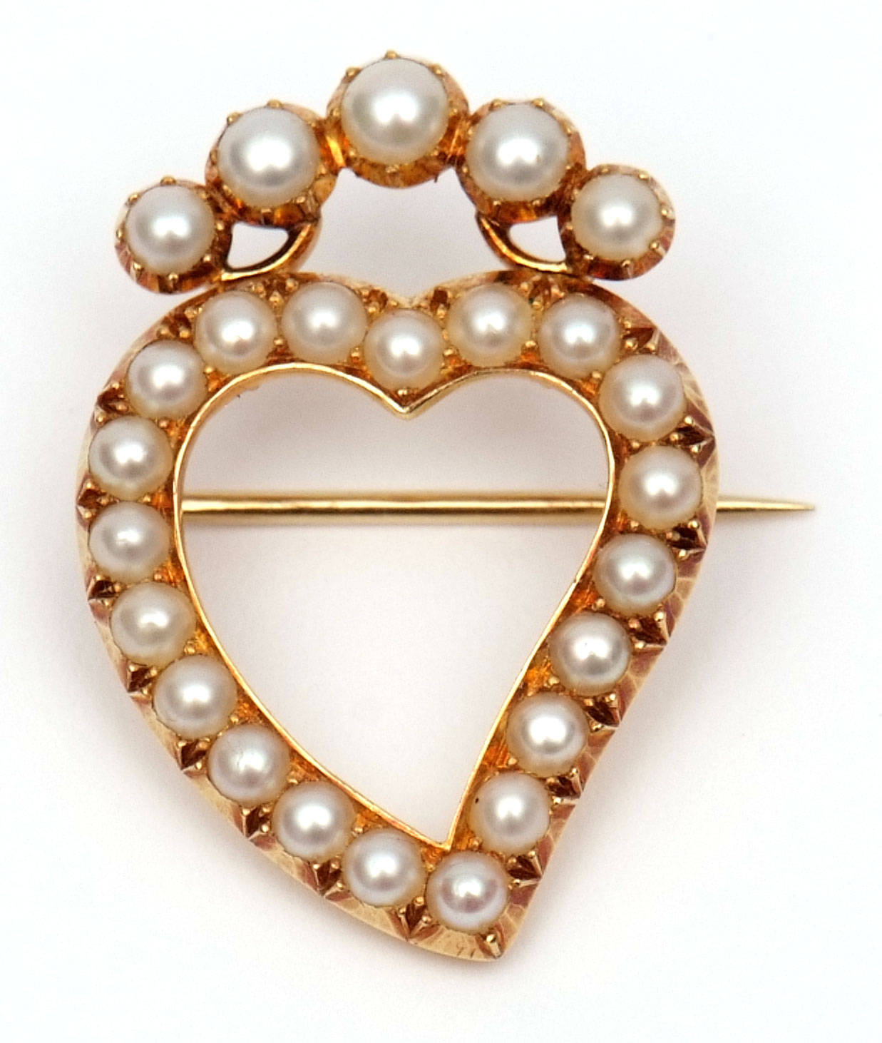 Late 19th/early 20th century heart shaped seed pearl brooch of open work design having 20 uniform