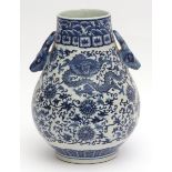Chinese blue and white porcelain vase of pear form with applied stag handles, finely decorated