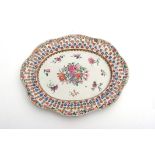 Chinese porcelain reticulated chestnut bowl stand decorated with floral sprays, 26 1/2cm wide