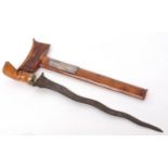 Mid-20th century presentation Kris of typical form with wavy double edged blade and brass mounts