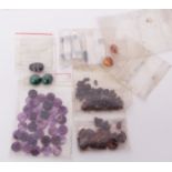 Mixed Lot: packet containing a collection of various, mainly rough cut, semi-precious stones