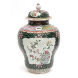 Large Chinese porcelain jar and cover delicately painted in famille rose enamels with reserves of