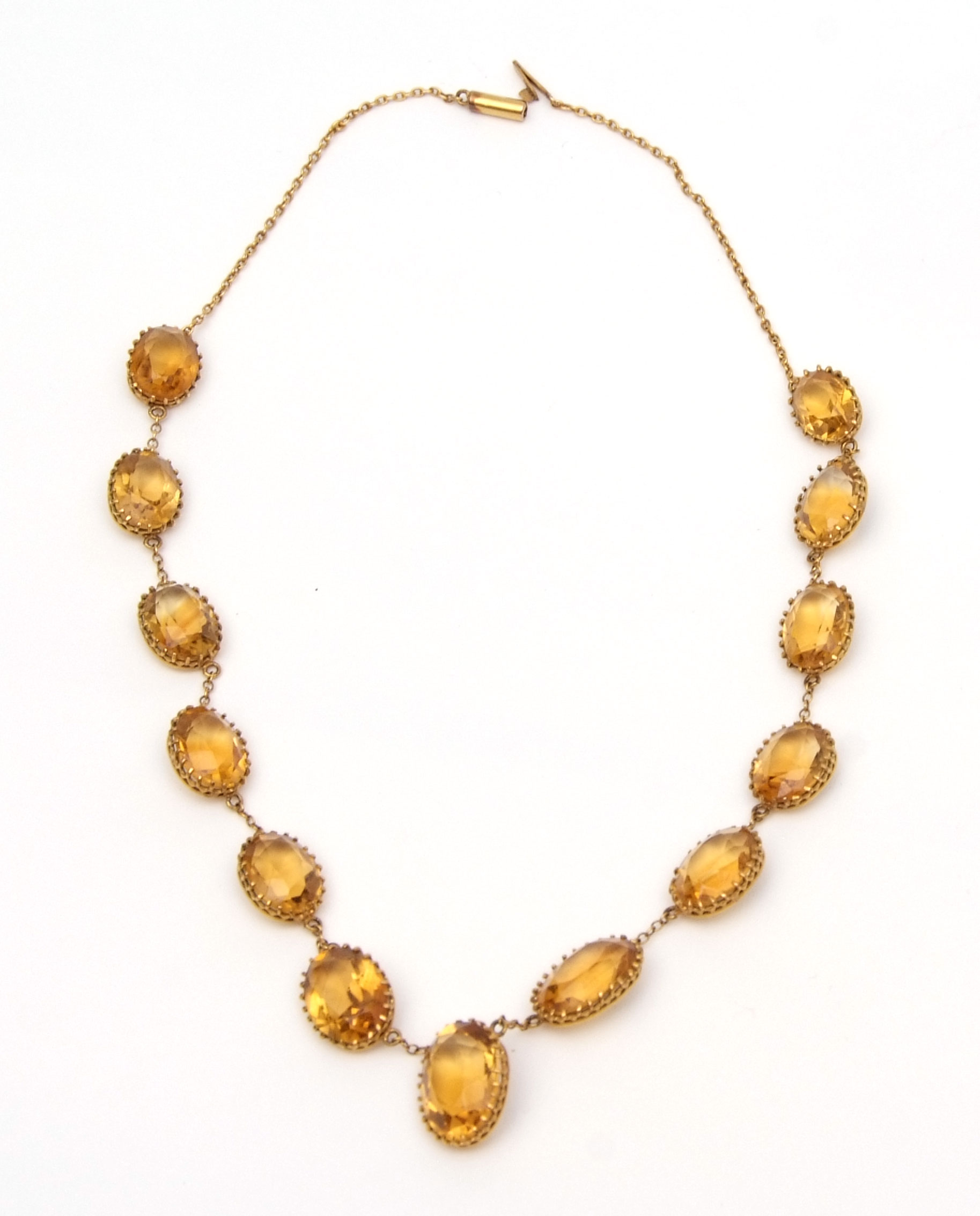 Citrine mounted riviere necklace, mounted with graduated oval shaped citrines in coronet mounts, all