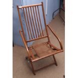 Late 19th century campaign type folding armchair with stick back and split cane seat and with