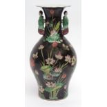 Chinese porcelain vase decorated in famille rose enamels with lotus and aquatic scenes against a