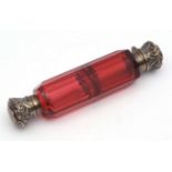 Late 19th century double ended cylindrical perfume flask, the faceted ruby glass body fitted with