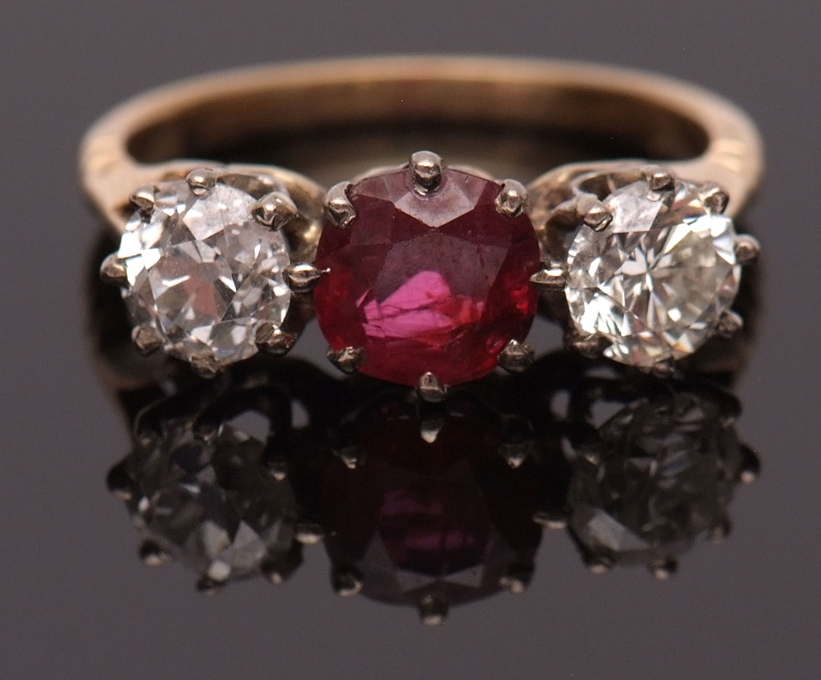 Precious metal ruby and diamond three-stone ring, the circular cut ruby 0.73ct (est) between two old - Bild 2 aus 2