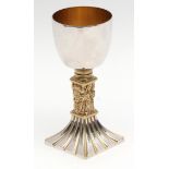 Elizabeth II parcel gilt commemorative goblet with polished bowl and figural stem on a spreading