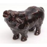 Oriental ceramic model of a water buffalo with heavy mottled black and maroon glaze, 20cm high