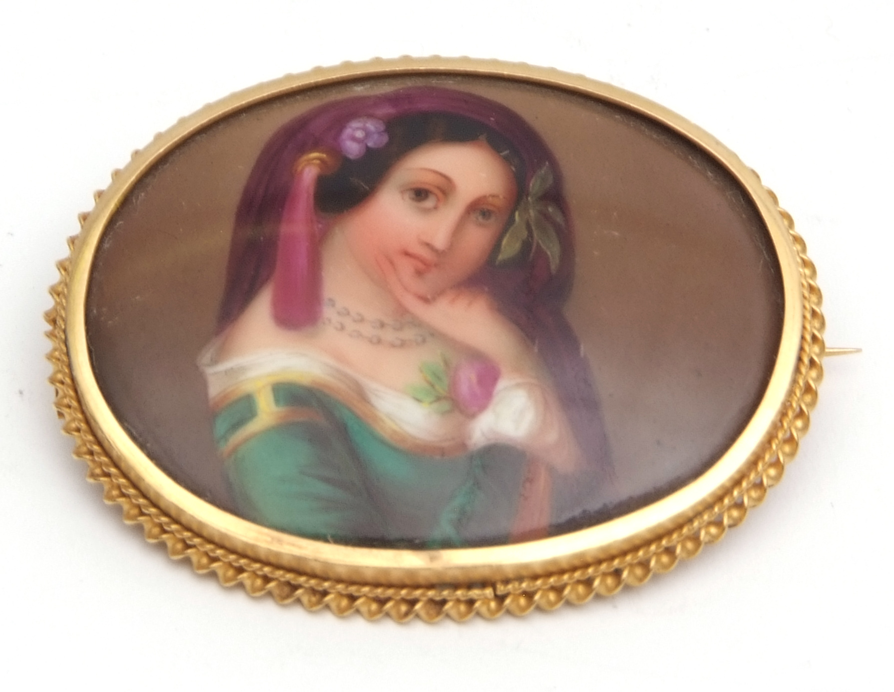 Victorian hand painted porcelain brooch, the oval shaped plaque painted with a lady in classical