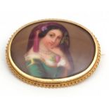 Victorian hand painted porcelain brooch, the oval shaped plaque painted with a lady in classical