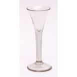 18th century wine glass with conical bowl, latticinio stem and spreading circular foot, 17cm high