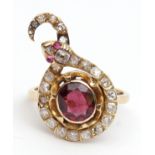 Ruby and diamond snake ring, the centre having an oval shaped ruby with a diamond set coiled body