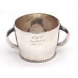 George V Irish two-handled cup of polished circular form with hollow cast and applied handles over a