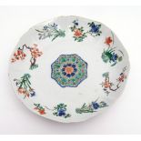 Chinese porcelain shallow dish of gentle octagonal form, decorated in famille vert enamels, in