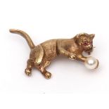 Modern 9ct gold cat brooch, a textured design set with two small circular cut ruby eyes and small