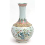 Porcelain bottle vase finely enamelled in famille rose palette with a continuous band of various