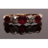 Diamond and ruby five-stone ring, alternate set with three graduated circular cut rubies and two