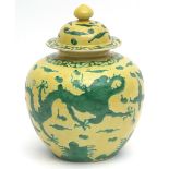 Large Chinese porcelain jar and cover of globular form, decorated in famille vert, with writhing