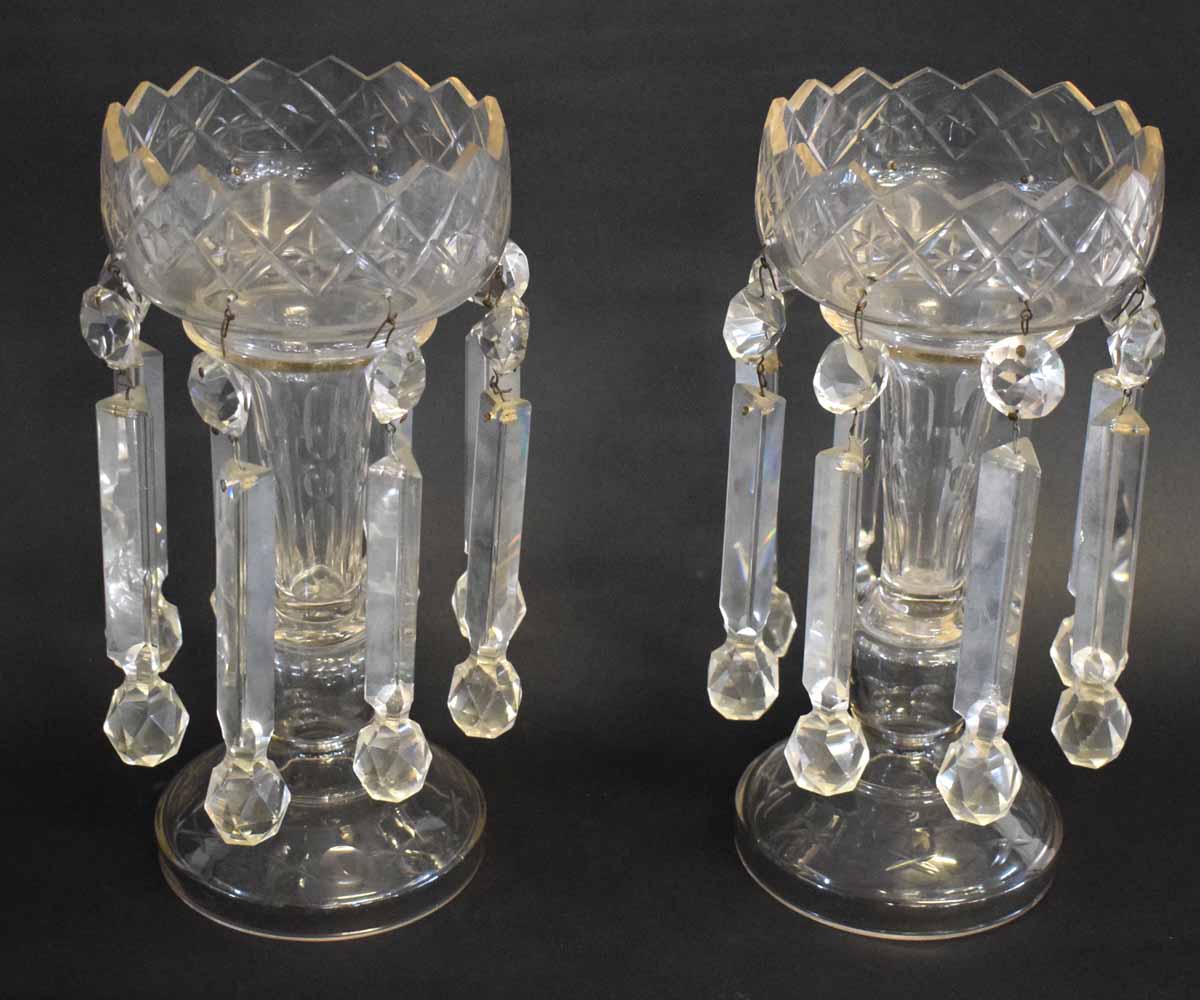 Pair of clear cut glass lustres with castellated top, with prismatic drops, each 30cms tall