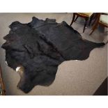 Natural brown cow-hide rug, 190cms wide x 200cms long