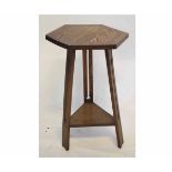 Arts & Crafts designed hexagonal topped side table supported by three planked legs with stylised