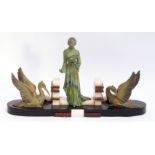 Art Deco period cold painted bronze group of a woman standing with a dove on her left hand,