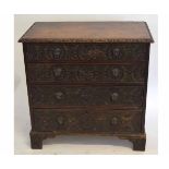 Victorian oak Gothic carved four-drawer bachelor's chest with carved out lion head handles, raised