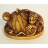 Japanese ivory netsuke modelled as a Kappa and Lotus