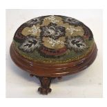 Victorian mahogany squat circular stool with beadwork upholstered top supported by three scrolling