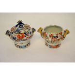 Two mid-19th century ironstone tureens, probably Mason's, decorated in Imari style, with a golden