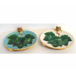 Pair of George Jones Majolica dishes with cabbage leaf centre with raised fox, with one dish with