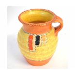 Crown Ducal Charlotte Reid style jug, decorated in orange and yellows with a ribbed body and open