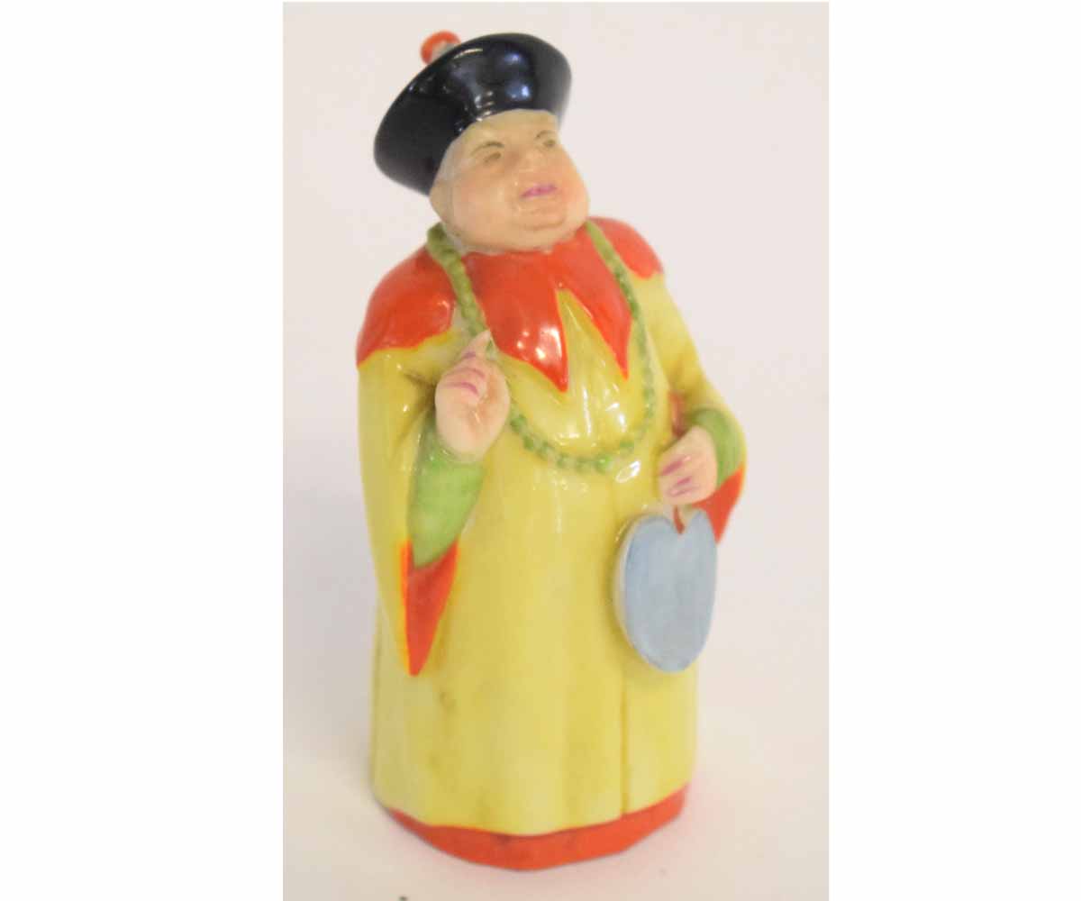 Royal Worcester candle snuffer modelled as an Oriental figure, with printed mark to base, 10cms tall