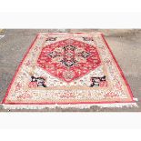 Good quality modern Heriz carpet decorated in a cream ground with a central rust lozenge with floral