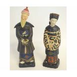 Pair of 20th century Chinese porcelain models of figures, wearing typical dress, decorated in