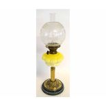 Victorian oil lamp with brass reeded column and an oak and acorn circular brass pressed base, with a