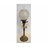 Victorian oil lamp with reeded column and cast circular base, with clear glass font and opaque shade