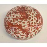 Good quality Chinese iron red decorated circular bowl and cover, with writhing dragons amidst