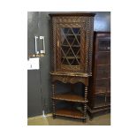 Victorian Gothic oak carved floor standing corner cupboard, the top fitted with single astragal